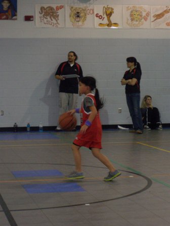 Kasen playing Upward basketball